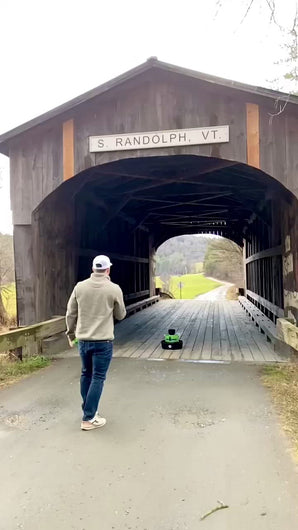 slow motion bulzi bucket lawn game throw on a covered bridge 