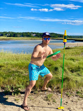 Load image into Gallery viewer, a man getting ready to catch a frisbee ricocheting off pole at beach
