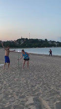 Load and play video in Gallery viewer, video clip of guy and girl playing bottle bash at beach in South Boston.
