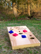 Load image into Gallery viewer, triple threat cornhole yard game with red and blue bags

